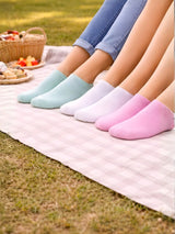 Four pairs of colorful socks on a picnic blanket with a basket of food in the background.

Pastel ladies trainer socks for casual wear by Stylewar