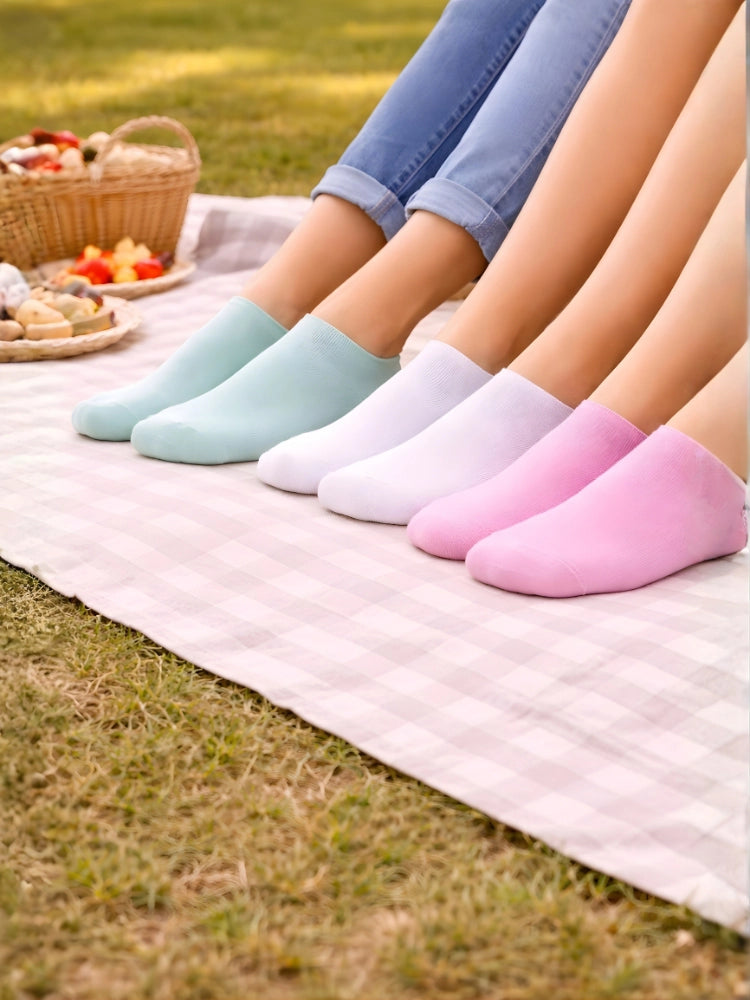 Four pairs of colorful socks on a picnic blanket with a basket of food in the background.

Pastel ladies trainer socks for casual wear by Stylewar