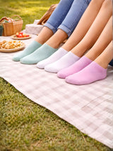 Four pairs of colorful socks on a picnic blanket with a grassy background

Ladies pastel trainer socks by Stylewar
