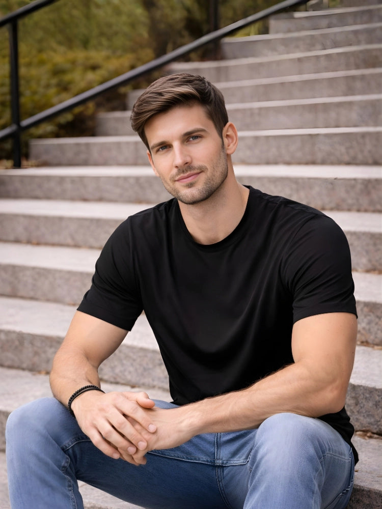 Man sitting on steps wearing a black t-shirt and blue jeans

Black men’s classic crew neck T-shirt casual everyday wear by Stylewar