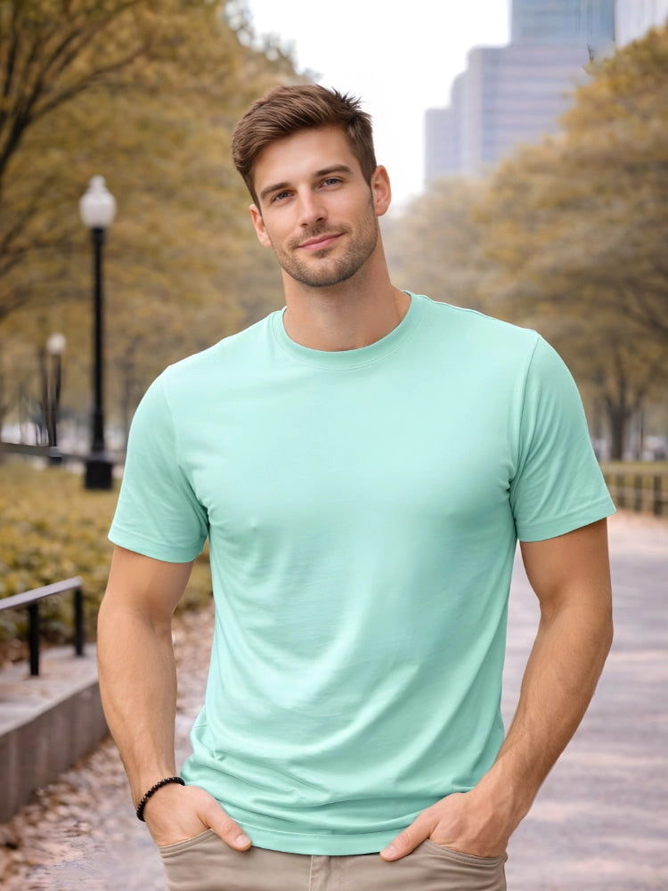 Man wearing a light green t-shirt standing outdoors with trees and buildings in the background

Men’s green crew neck half sleeve T-shirt by Stylewar