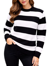 Black and white striped sweater worn by a person. Womens Black & White Stripe Knitted Jumper