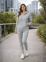 Woman in gray tracksuit walking on a path with cityscape in the background

Women’s Grey Melange Zip Hoodie & Jogger Tracksuit Set