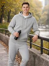 Man in gray tracksuit holding a water bottle by a lakeside

Men’s grey melange zip hoodie and jogger tracksuit set by Stylewar