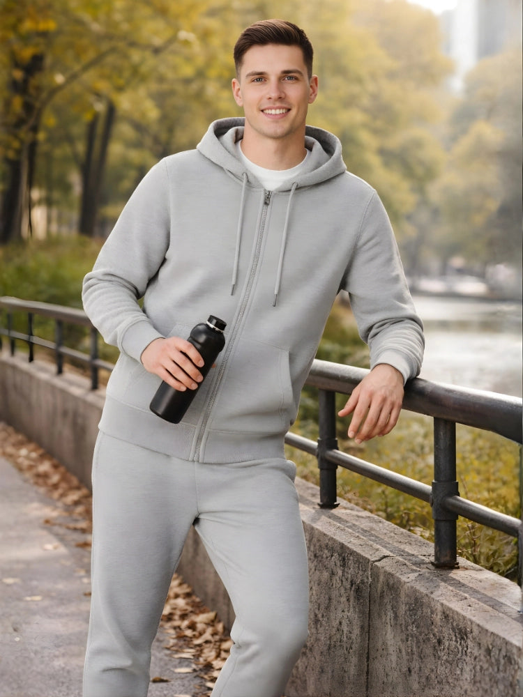 Man in gray tracksuit holding a water bottle by a lakeside

Men’s grey melange zip hoodie and jogger tracksuit set by Stylewar