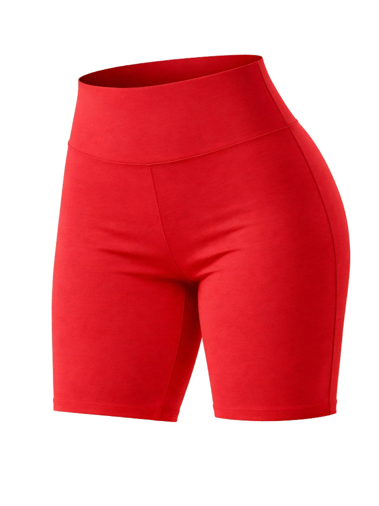 Person wearing a black tank top and red shorts standing outdoors on a path. Women’s Cotton Elastic Stretch Breathable Red Cycling Shorts
