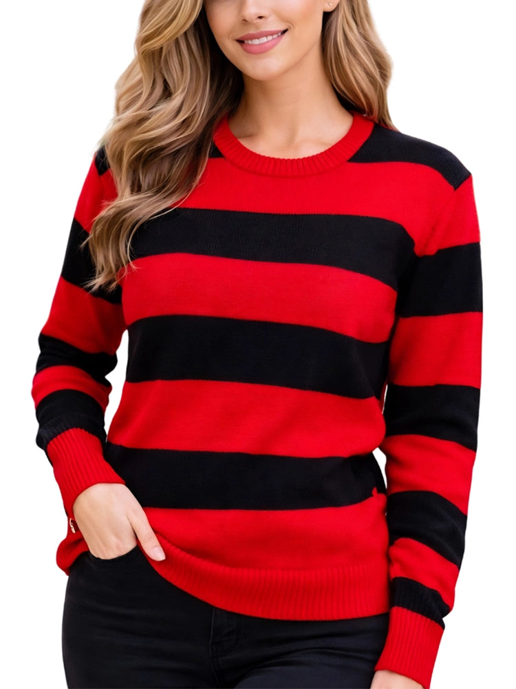 Red and black striped sweater worn by a person on a white background. Close-up of ladies red and black stripe knitted jumper casual outfit