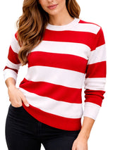Woman wearing a red and white striped sweater in an outdoor setting with trees and buildings. Women’s Red & White Stripe Knitted Jumper